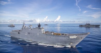 HMAS Canberra, front, conducts manoeuvres with USS New Orleans, left, JS Makinami and USS America during the Large Scale Global Exercise in the Western Pacific. Photo by Leading Seaman Ernesto Sanchez.