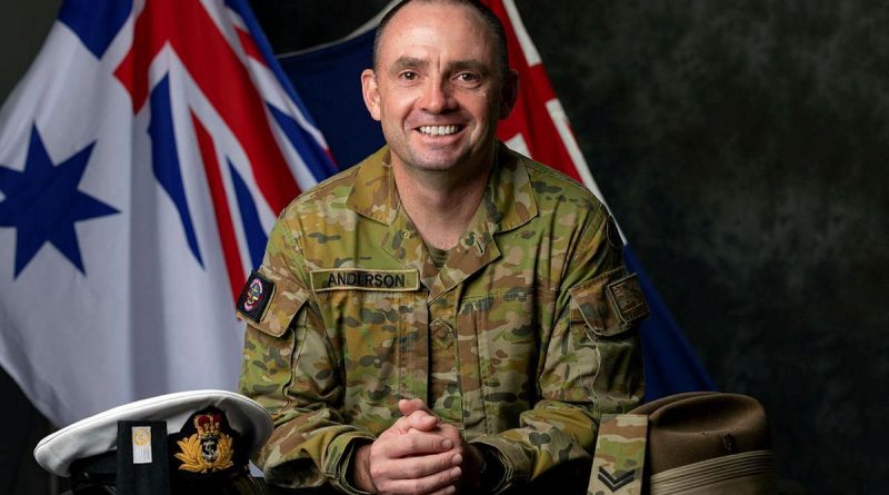 Midshipman Benjamin Anderson with his Navy officer's cap and Army slouch hat after transferring services and commissioning as a maritime logistics officer with Navy. Story by Lieutenant Gordon Carr-Gregg. Photo by Leading Seaman Shane Cameron.