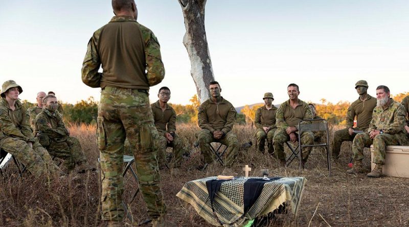 Chaplain Gary Pope, of the 3rd Brigade Headquarters, delivers a field service to soldiers during Exercise Talisman Sabre at Townsville Field Training Area, Queensland. Story by Captain Diana Jennings. Photo by Corporal Brendon Grey.