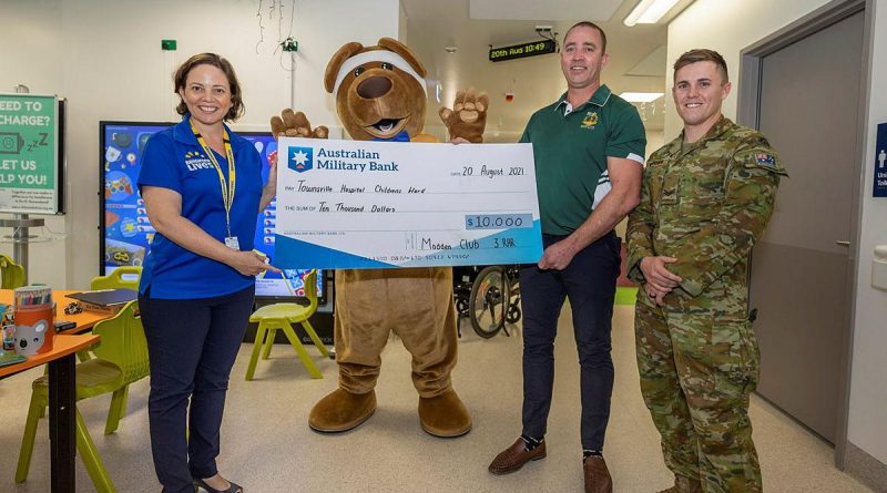 Soldiers from 3RAR donate a cheque for $10,000 to the children’s ward at Townsville University Hospital. Story by Captain Lily Charles. Photo by Corporal Brandon Grey.