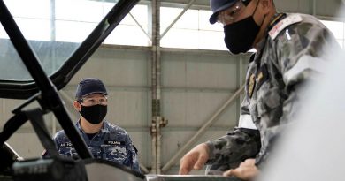 Trainee avionics technician Seaman Nattapol Popan, right, receives theory instruction from Royal Australian School of Technical Training Instructor Flight Lieutenant Chris Polman. Story by Flight Lieutenant Julia Ravell.