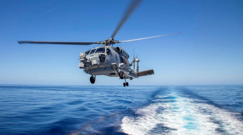 HMAS Ballarat's MH-60R, Convict, launches from the flight deck during Exercise Talisman Sabre. Story by Lieutenant Commander Ryan Zerbe. Photo by Leading Seaman Ernesto Sanchez.