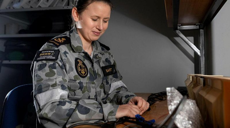 Petty Officer Electronics Technician Emma Barnett conducts work at HMAS Albatross in Nowra. Story by Sub Lieutenant Nancy Cotton. Photo by Leading Seaman Ryan Tascas.