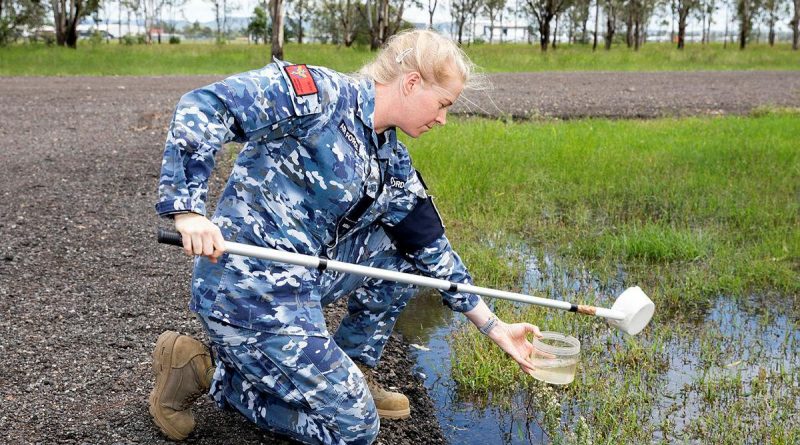 Air Force environmental health officer, Flying Officer Jamie Clifford from No 1 Expeditionary Health Squadron, looks for mosquito larva in samples of water during Exercise Regimen White 21 at RAAF Base Amberley. Story by Flying Officer Robert Hodgson. Photo by Leading Aircraftwoman Emma Schwenke.