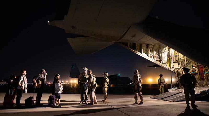 Evacuees board the first Australian rescue flight out of Kabul, Afghanistan. Photo by Sergeant Glen McCarthy.