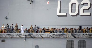The ship's company of HMAS Canberra commemorates the 79th anniversary of the Battle of Savo Island on the flight deck while at sea in the Western Pacific. Story by Lieutenant Sarah Rohweder. Photo by Leading Seaman Ernesto Sanchez.
