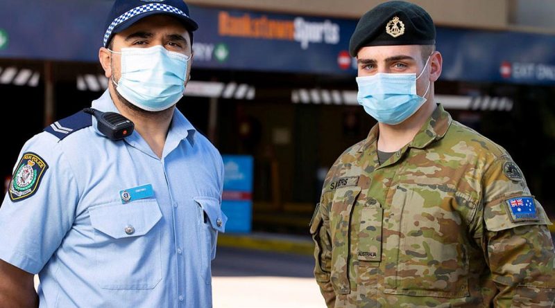 NSW Police and Private Jordan Sayers work together to patrol the Bankstown sports centre in support of the NSW Operation Covid-19 Assist. Story by Lieutenant Commander John Thompson. Photo by Corporal Dustin Anderson.