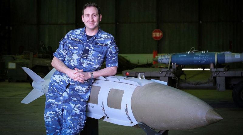 Defence Explosive Ordnance Training School instructor Flight Lieutenant Ben Lindsay with a teaching aid, a 2000-pound joint direct attack munition. Story by Flight Lieutenant Julia Ravell.