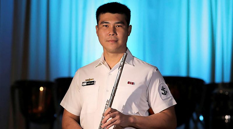 Leading Seaman Henry Liang with his flute. Story by Leading Seaman Jonathan Rendell. Photo by Petty Officer Nina Fogliani.