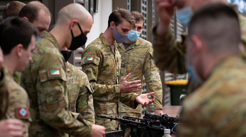 Corporal Thomas Hamelink, of 2nd/14th Light Horse Regiment (Queensland Mounted Infantry), explains the bullet expenditure system his group developed during an innovation sprint activity at Gallipoli Barracks, Brisbane. Story by Captain Jesse Robilliard. Photo by Corporal Nicole Dorrett.