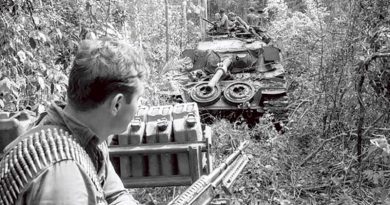 Private Frank Jelen of 3RAR sitting on an armoured recovery vehicle during Operation Overlord on the border of Phuoc Tuy and Long Khanh Provinces, June 1971.