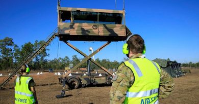 Leading Aircraftwoman Rebecca Hay and Corporal Thomas Geraghty raise the transportable air operations tower at RAAF Base Scherger. Story by Flight Lieutenant Nick O’Connor. Photo by Corporal Brett Sherriff.