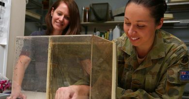 Army scientific officer Captain Lisa Rigby, right, feeds mosquitoes as part of her research. Story by Captain Annie Richardson.