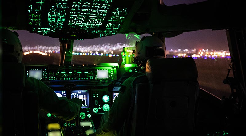 Royal Australian Air Force C-17A Globemaster pilots Flight Lieutenants Sam Stephens and Stephen Vanderdoes prepare to take off from Hamid Karzai International Airport after boarding Australian citizens and visa holders to evacuate from Afghanistan. Photo by Sergeant Glen McCarthy.