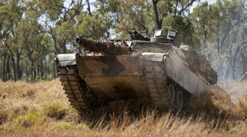 An Australian Army M1A1 Abrams tank from the 2nd Cavalry Regiment moves forward in a simulated attack serial held at the Townsville Field Training Area as part of Exercise Talisman Sabre. Story by Warrant Officer Class 2 Max Bree. Photo by Corporal Brandon Grey.