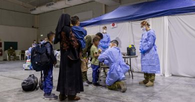An Australian Defence Force medic assesses a child in the evacuee handling centre at Australia’s main operating base in the Middle East. Story by Lieutenant Max Logan. Photo by Leading Aircraftwoman Jacqueline Forrester.