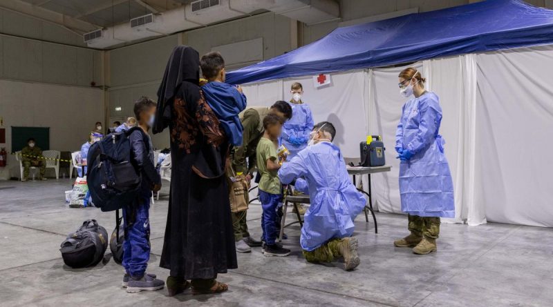 An Australian Defence Force medic assesses a child in the evacuee handling centre at Australia’s main operating base in the Middle East. Story by Lieutenant Max Logan. Photo by Leading Aircraftwoman Jacqueline Forrester.