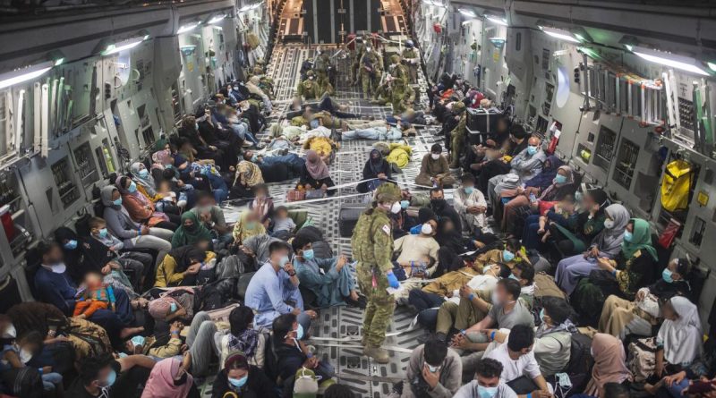 Australian citizens and visa holders evacuated from Afghanistan on board a RAAF C-17A Globemaster III, enroute to the ADF’s main operating base in the Middle East region. Story by Lieutenant Commander Andrew Ragless. Photo by Sergeant Glen McCarthy.