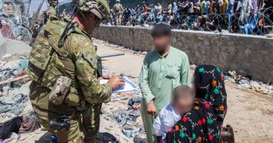 Major Tim Glover assists DFAT members locate Afghan Australian visa holders attempting to enter the congested Abbey Gate at Hamid Karzai International Airport. Story by Lieutenant Max Logan. Photo by Sergeant Glen McCarthy.