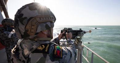 Leading Seaman Boatswains Mate Thomas Kelly engages a ‘hostile’ craft with a 12.7mm heavy machine gun aboard HMAS Childers during a defensive training activity. Story by Lieutenant Gordon Carr-Gregg. Photo by Petty Officer Peter Thompson.