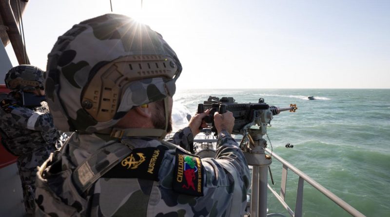 Leading Seaman Boatswains Mate Thomas Kelly engages a ‘hostile’ craft with a 12.7mm heavy machine gun aboard HMAS Childers during a defensive training activity. Story by Lieutenant Gordon Carr-Gregg. Photo by Petty Officer Peter Thompson.