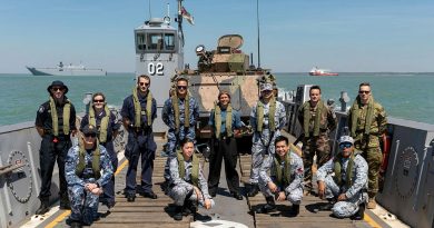 Embarked foreign personnel for Indo-Pacific Endeavour 21 stand on-board a Light Landing Craft from HMAS Canberra off the Port of Darwin before departing for Exercise Indo-Pacific Endeavour 21. Story by Captain Peter March. Photo by Leading Seaman Sittichai Sakonpoonpol.