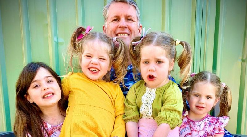 Flight Lieutenant Neil Young with his daughters, from left, Alexa, 6, twins Ella and Sophia, 2, and Ariana, 4. Story by Bettina Mears.