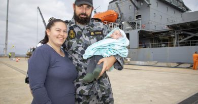 Leading Seaman Jamie Martin is farewelled by wife Teaghan and son Sterling as HMAS Sirius prepares to depart Fleet Base West, Western Australia, for her final deployment. Story by Lieutenant Commander Ric Mingramm. Photo by Leading Seaman Richard Cordell.