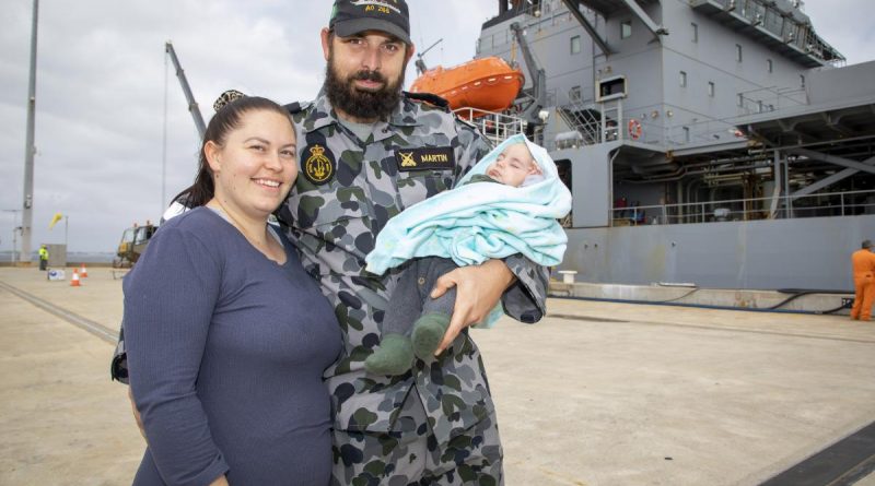 Leading Seaman Jamie Martin is farewelled by wife Teaghan and son Sterling as HMAS Sirius prepares to depart Fleet Base West, Western Australia, for her final deployment. Story by Lieutenant Commander Ric Mingramm. Photo by Leading Seaman Richard Cordell.