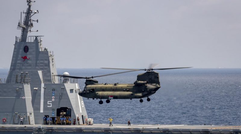 A Boeing CH-47 Chinook, from the Republic of Singapore Air Force, conducts training with HMAS Canberra during Indo-Pacific Endeavour 21. Story by Captain Peter March. Photo by Seaman Leo Baumgartner.