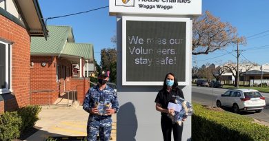 Aircraftman Antonio Keedle-Gradenza presents the donations to Lisa Simpson in Wagga Wagga. Story by Flying Officer Brent Moloney.