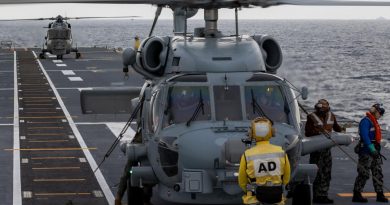 Royal Malaysian Navy Super Lynx and RAN MH-60R helicopters perform deck landing exercises on board HMAS Canberra as part of the Malaysia-Australia Training Exercise. Story by Captain Peter March. Photo by Petty Officer Christopher Szumlanski.