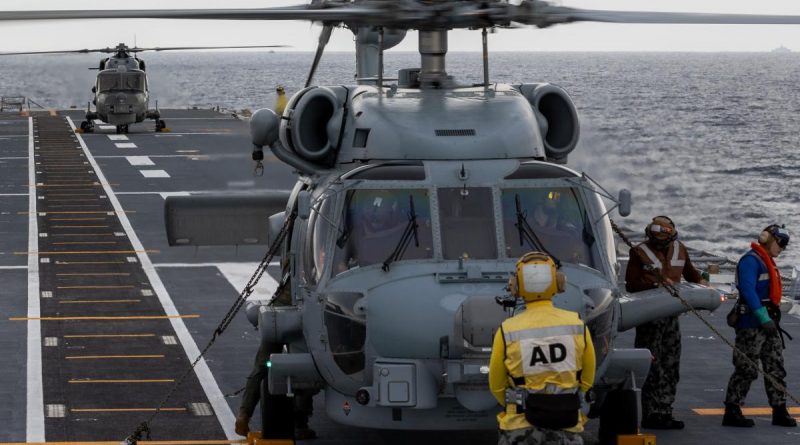 Royal Malaysian Navy Super Lynx and RAN MH-60R helicopters perform deck landing exercises on board HMAS Canberra as part of the Malaysia-Australia Training Exercise. Story by Captain Peter March. Photo by Petty Officer Christopher Szumlanski.