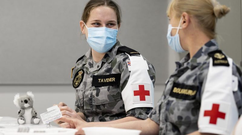 Seaman Alexis Tavener and Leading Seaman Katrina Bougiouras prepare Covid-19 vaccinations at the Orange Vaccination Hub while deployed on NSW Operation COVID-19 Assist. Story by Lieutenant Brendan Trembath. Photo by Corporal Dustin Anderson.