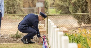 Air Commodore Ross Bender lays a sprig of rosemary at one of the grave sites during a commemoration ceremony at Mallala War Cemetery. Story by Group Captain Greg Weller. Photo by Leading Aircraftman Stewart Gould.