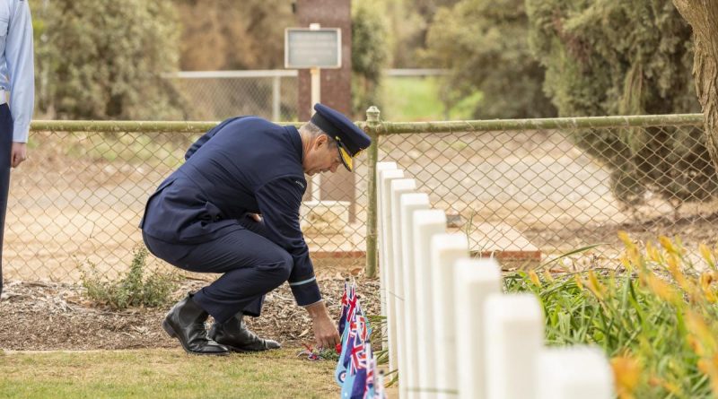 Air Commodore Ross Bender lays a sprig of rosemary at one of the grave sites during a commemoration ceremony at Mallala War Cemetery. Story by Group Captain Greg Weller. Photo by Leading Aircraftman Stewart Gould.