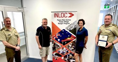 Major Jeff Martin, from No. 51 Far North Queensland Regiment, Paul Boag, Inloc CEO, Sergeant Kym Walker, of No. 51 FNQR and an Inloc employee, and Major Ben Lanskey, of Defence Reserve Support, at the award ceremony. Photo by Lieutenant Nic Hawkins