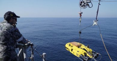 Leading Seaman Dale Timbs launches remotely operated vehicle Double Eagle to search for a simulated mine off the coast of Evans Head, NSW. Story by Lieutenant Geoff Long. Photo by Midshipman Jack Hawkins.