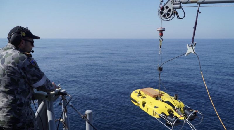 Leading Seaman Dale Timbs launches remotely operated vehicle Double Eagle to search for a simulated mine off the coast of Evans Head, NSW. Story by Lieutenant Geoff Long. Photo by Midshipman Jack Hawkins.