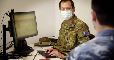 Major Timothy Chan, Officer Commanding Bravo Company, Joint Task Force 629.1.1, works with a member of the task force at HMAS Kuttabul, Sydney. This image has been digitally altered. Photo by Aircraftwoman Kate Czerny.