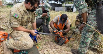 Australian Army soldier Corporal Zed Zapletal works alongside Timor-Leste Defence Force soldiers during a lesson on chainsaw maintenance and operation during Exercise Hari'i Hamutuk 2021 at Metinaro Military Base, Timor-Leste. Story and photo by Leading Seaman Jarrod Mulvhill.
