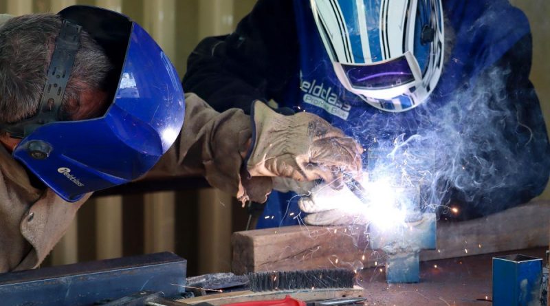 Sapper Malcolm Stewart, left, teaches Andrew Poonkamelya, a local member from the Pormpuraaw Community in Cape York Peninsula, welding techniques during AACAP 2021. story by Captain Evita Ryan.