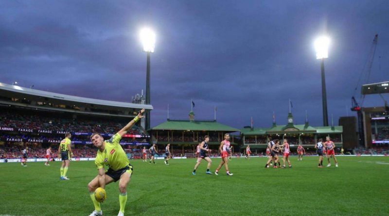 ADF Aussie Rules Association’s Sergeant David Wood umpires an AFL match at the SCG during the 2021 Toyota AFL Sir Doug Nicholls Round. Story by Lieutenant Ben Willee.