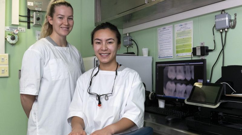 Able Seaman Dental Assistant Caitlin Taylor, left, and Dental Officer Lieutenant Danica Zhan are embarked on HMAS Canberra to care for the dental health of the task group during Indo-Pacific Endeavour. Story by Lieutenant Alicia Morris, Royal Canadian Navy. Photo by Leading Seaman Nadav Harel.