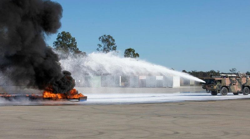 Air Force’s No. 23 Squadron Aviation Rescue and Fire Fighting personnel apply fluorine-free foam to extinguish a large demonstration aviation fuel blaze. Story by Flying Officer Robert Hodgson. Photo by Sergeant Andrew Eddie.