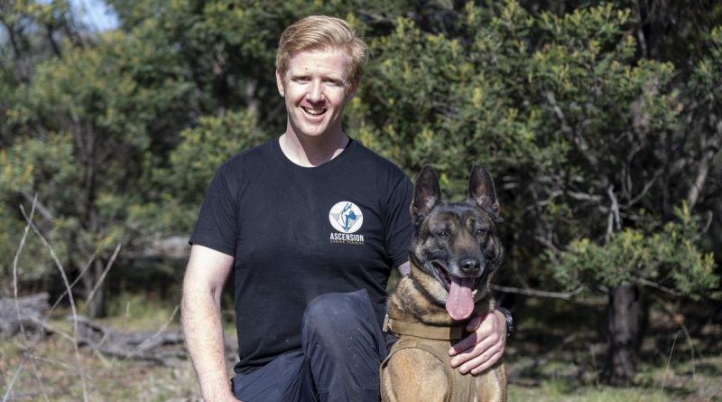 Corporal Jeremy Wikner with his Belgian malinois, Charlie.