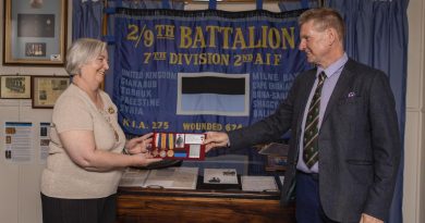 Len Kelly returns the medals of World war I veteran Lieutenant Norman Weynand to his family member Lynne Bennett at the 9th Battalion Museum at Gallipoli Barracks Brisbane. Story by Corporal Olivia Cameron.