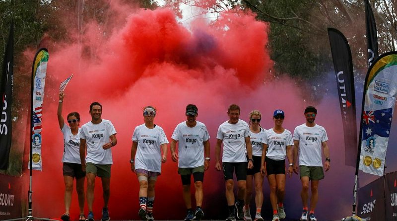 Australian and American ultramarathon runners celebrate the completion of the 1000 Miles to Light run held around Singleton Military Area, NSW. Story by Lieutenant Sasha Rhodes.