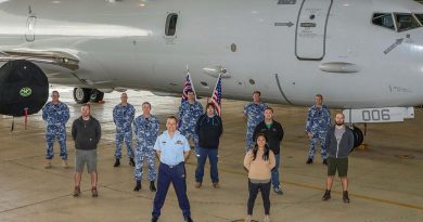Officer Commanding No. 92 Wing, Group Captain John Grime, front centre, stands with staff and personnel from Surveillance and Response Systems Program Office, No. 92 Wing and Boeing in front of P-8A Poseidon A47-006. Story by Bettina Mears. Photo by Corporal Brenton Kwaterski.