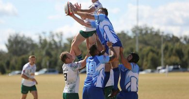 A player from the Royal Australian Corps of Signals Rugby Union Football Club team rises above a Toowoomba Police player in the annual Brett Forte Cup memorial rugby game in Queensland. Story by Flying Officer Evita Ryan. Photo by Corporal Joshua Thomas.